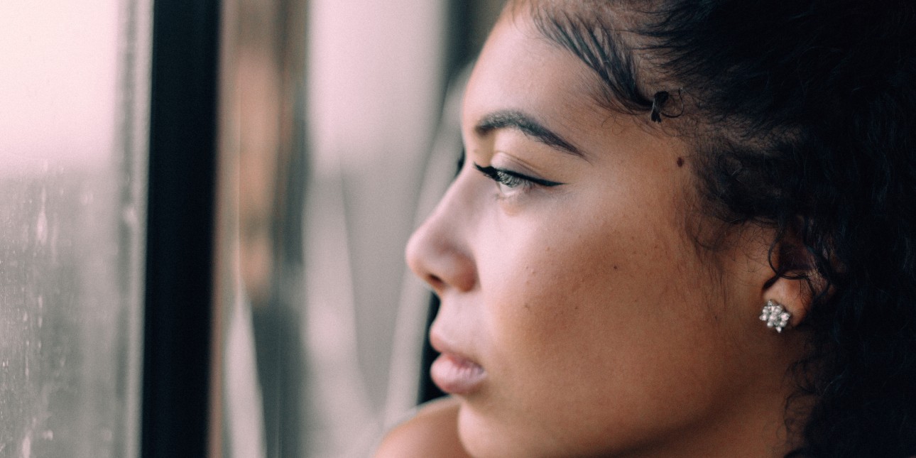 Woman looking out window