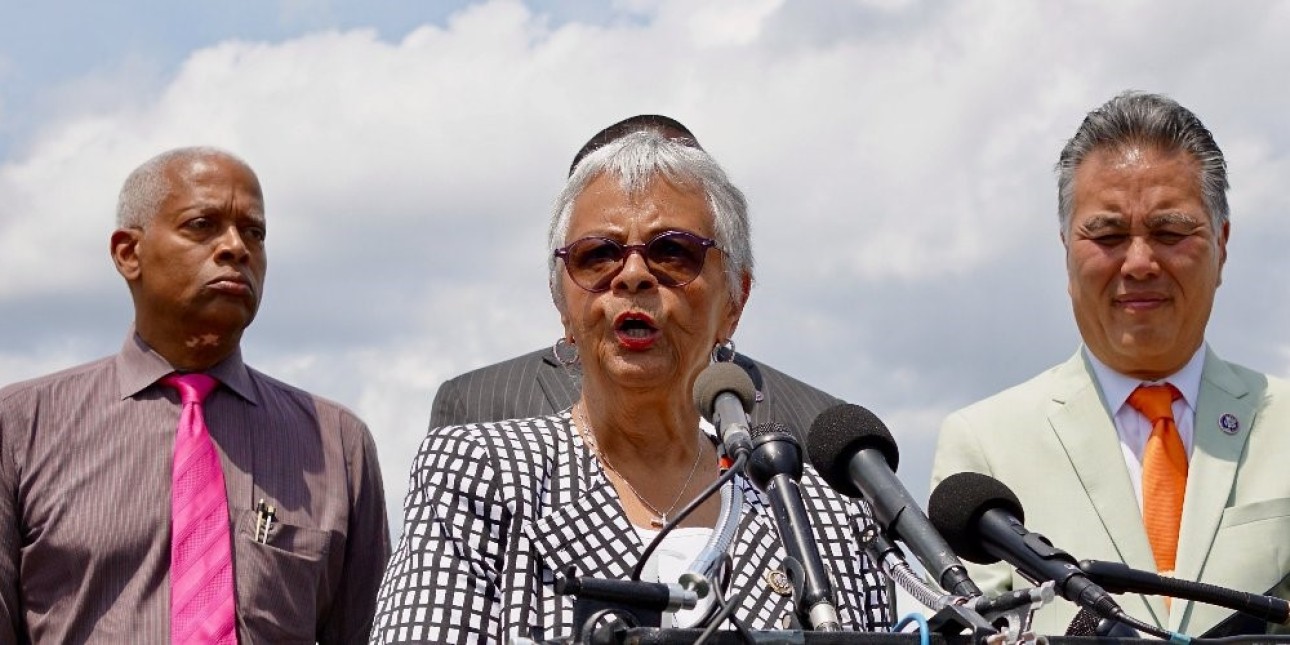 Rep. Bonnie Watson Coleman speaking outside at podium.