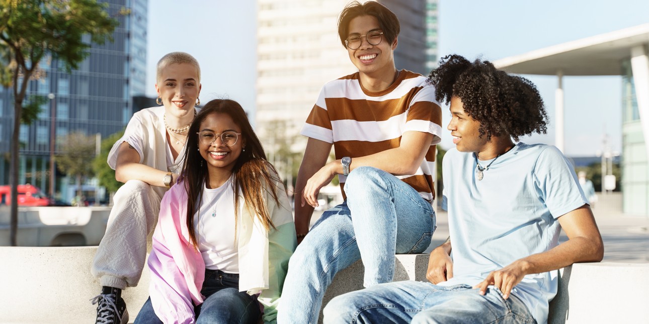 Diverse youth outside in the sun in an urban setting