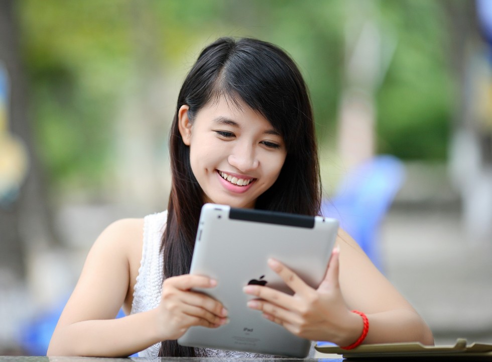 young person looking at an ipad