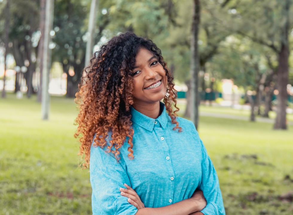 Person standing outside smiling