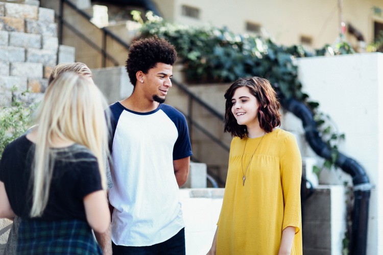 Youth standing and talking