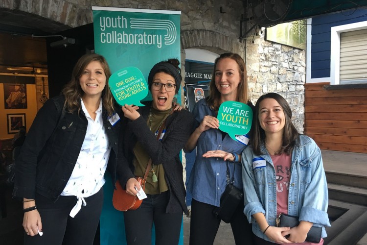 group of people posing with youth collaboratory signs