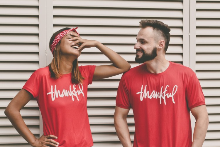 woman & man wearing "thankful" shirts