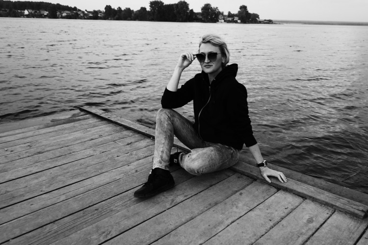 girl sitting on a dock