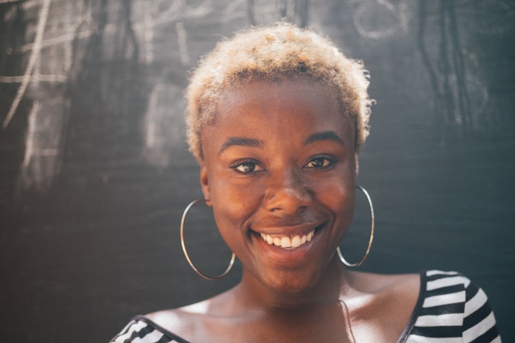 young adult black woman smiling