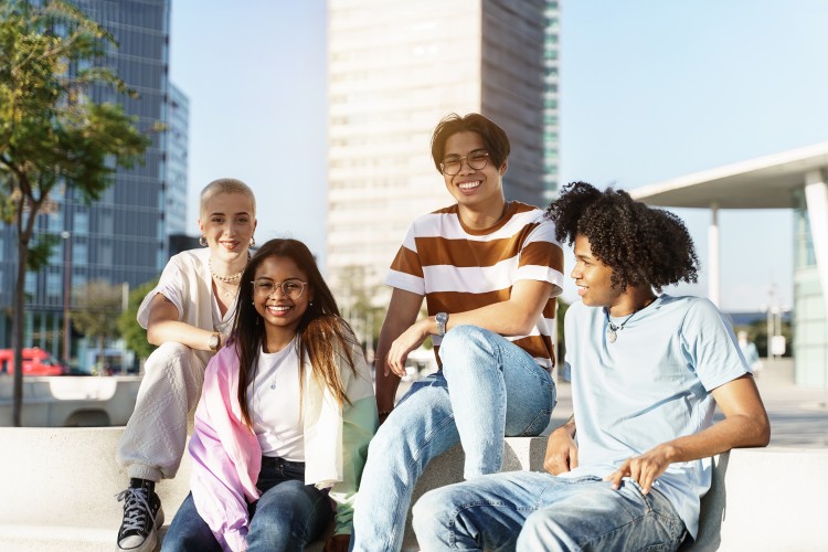 Diverse youth outside in the sun in an urban setting